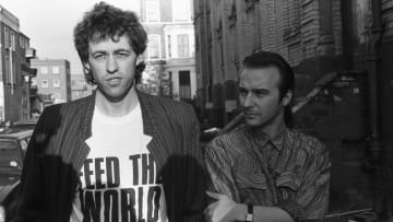 Bob Geldof (L) and Midge Ure (R) outside a London recording studio while working on "Do They Know It's Christmas?" on November 25, 1984.