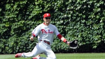 May 29, 2016; Chicago, IL, USA; Philadelphia Phillies left fielder Tyler Goeddel (2) fields a ball hit by Chicago Cubs catcher Miguel Montero (47) in the fifth inning at Wrigley Field. Mandatory Credit: Matt Marton-USA TODAY Sports