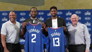 Head coach Doc Rivers, Paul George, Kawhi Leonard and owner Steve Ballmer of the Los Angeles Clippers attend the Paul George and Kawhi Leonard introductory press conference at Green Meadows Recreation Center. (Photo by Kevork Djansezian/Getty Images)