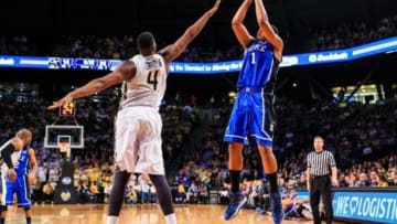 Feb 18, 2014; Atlanta, GA, USA; Duke Blue Devils forward Jabari Parker (1) shoots a basket over Georgia Tech Yellow Jackets forward Robert Carter, Jr. (4) in the first half at Hank McCamish Pavilion. Mandatory Credit: Daniel Shirey-USA TODAY Sports