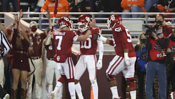 Nov 21, 2020; Norman, Oklahoma, USA; Oklahoma Sooners wide receiver Theo Wease (10) celebrates with quarterback Spencer Rattler (7) after scoring a touchdown during the first half against the Oklahoma State Cowboys at Gaylord Family-Oklahoma Memorial Stadium. Mandatory Credit: Kevin Jairaj-USA TODAY Sports