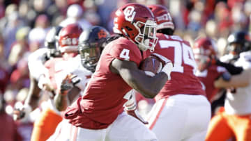 NORMAN, OK - NOVEMBER 10: Running back Trey Sermon #4 of the Oklahoma Sooners runs outside against the Oklahoma State Cowboys at Gaylord Family Oklahoma Memorial Stadium on November 10, 2018 in Norman, Oklahoma. Oklahoma defeated Oklahoma State 48-47. (Photo by Brett Deering/Getty Images)