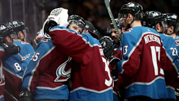 DENVER, COLORADO - OCTOBER 12: Andre Burakovsky #95 of the Colorado Avalanche is congratulated by his teammates after scoring the winning goal against the Arizona Coyotes in overtime at the Pepsi Center on October 12, 2019 in Denver, Colorado. (Photo by Matthew Stockman/Getty Images)