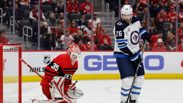 Jan 10, 2023; Detroit, Michigan, USA; Detroit Red Wings goaltender Ville Husso (35) makes the save in front of Winnipeg Jets right wing Blake Wheeler (26) in the third period at Little Caesars Arena. Mandatory Credit: Rick Osentoski-USA TODAY Sports