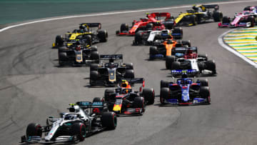 SAO PAULO, BRAZIL - NOVEMBER 17: Valtteri Bottas driving the (77) Mercedes AMG Petronas F1 Team Mercedes W10 leads Alexander Albon of Thailand driving the (23) Aston Martin Red Bull Racing RB15 and Pierre Gasly of France driving the (10) Scuderia Toro Rosso STR14 Honda at the start during the F1 Grand Prix of Brazil at Autodromo Jose Carlos Pace on November 17, 2019 in Sao Paulo, Brazil. (Photo by Dan Istitene/Getty Images)