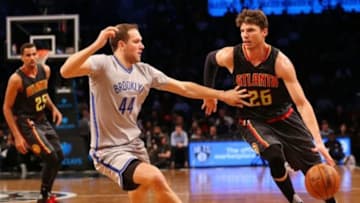 Nov 17, 2015; Brooklyn, NY, USA; Atlanta Hawks guard Kyle Korver (26) dribbles the ball around Brooklyn Nets guard Bojan Bogdanovic (44) during the third quarter at Barclays Center. The Nets won 90-88. Mandatory Credit: Anthony Gruppuso-USA TODAY Sports