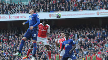 LONDON, ENGLAND - MAY 07: Danny Welbeck scores Arsenal's 2nd goal under pressure from Chris Smalling of Man Utd during the Premier League match between Arsenal and Manchester United at Emirates Stadium on May 7, 2017 in London, England. (Photo by David Price/Arsenal FC via Getty Images)