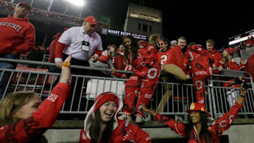 Ohio State Buckeye fans rush the field following a 33-24 win over the Penn State Nittany Lions Saturday's NCAA Division I football game at Ohio Stadium in Columbus.Osu21psu Bjp 1385