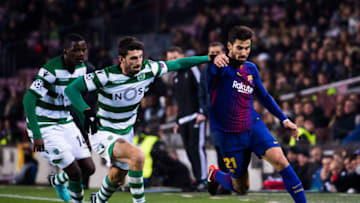 BARCELONA, SPAIN - DECEMBER 05: Andre Gomes of FC Barcelona conducts the ball under pressure from Cristiano Piccini and William Carvalho of Sporting CP during the UEFA Champions League group D match between FC Barcelona and Sporting CP at Camp Nou on December 5, 2017 in Barcelona, Spain. (Photo by Alex Caparros/Getty Images)
