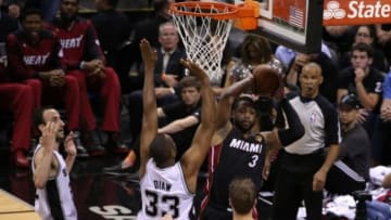 Jun 8, 2014; San Antonio, TX, USA; Miami Heat guard Dwyane Wade (3) looks to pass against San Antonio Spurs forward Boris Diaw (33) in game two of the 2014 NBA Finals at AT&T Center. Mandatory Credit: Soobum Im-USA TODAY Sports