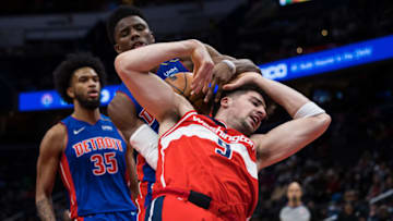 Deni Avdija #9 of the Washington Wizards is fouled by Hamidou Diallo #6 of the Detroit Pistons (Photo by Scott Taetsch/Getty Images)