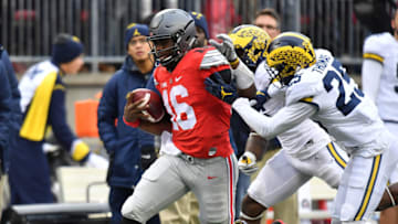 COLUMBUS, OH - NOVEMBER 26: J.T. Barrett #16 of the Ohio State Buckeyes rushes the ball during overtime against the Michigan Wolverines at Ohio Stadium on November 26, 2016 in Columbus, Ohio. (Photo by Jamie Sabau/Getty Images)