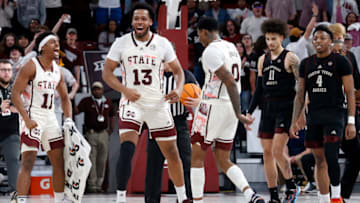 Feb 25, 2023; Starkville, Mississippi, USA; Mississippi State Bulldogs guard Eric Reed Jr. (11) and forward Will McNair Jr. (13) react with forward D.J. Jeffries (0) during a timeout in the second half against the Texas A&M Aggies at Humphrey Coliseum. Mandatory Credit: Petre Thomas-USA TODAY Sports