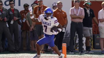 Sep 30, 2023; Austin, Texas, USA; Kansas Jayhawks wide receiver Trevor Wilson (7) reacts after scoring a touchdown during the second half against the Texas Longhorns at Darrell K Royal-Texas Memorial Stadium. Mandatory Credit: Scott Wachter-USA TODAY Sports
