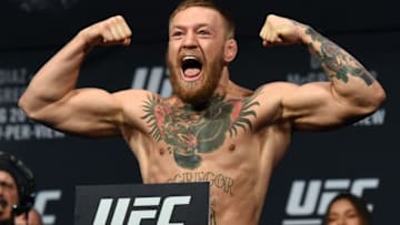 LAS VEGAS, NV - AUGUST 19: UFC featherweight champion Conor McGregor poses on the scale during his weigh-in for UFC 202 at MGM Grand Conference Center on August 19, 2016 in Las Vegas, Nevada. McGregor will meet Nate Diaz in a welterweight rematch on August 20, 2016, at T-Mobile Arena in Las Vegas. (Photo by Ethan Miller/Getty Images)