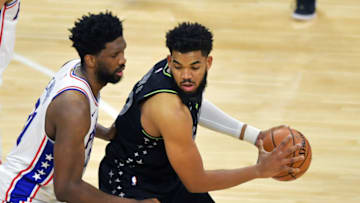 Joel Embiid of the Philadelphia 76ers defends against Karl-Anthony Towns of the Minnesota Timberwolves. (Photo by Drew Hallowell/Getty Images)