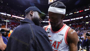 Former Miami Heat player Dwyane Wade and Jimmy Butler #22 of the Miami Heat meet on the court after a game against the New York Knicks(Photo by Megan Briggs/Getty Images)