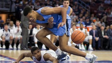 PHILADELPHIA, PA - NOVEMBER 10: Patrick Tape #3 of the Columbia Lions looses possession of the ball against Jermaine Samuels #23 of the Villanova Wildcats in the second half at the Wells Fargo Center on November 10, 2017 in Philadelphia, Pennsylvania. The Villanova Wildcats defeated the Columbia Lions 75-60. (Photo by Mitchell Leff/Getty Images)