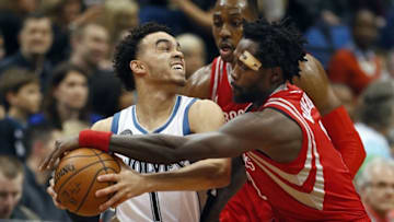 Apr 11, 2016; Minneapolis, MN, USA; Houston Rockets guard Patrick Beverley (2) tries to wrestle the ball away from Minnesota Timberwolves guard Tyus Jones (1) in the second quarter at Target Center. Mandatory Credit: Bruce Kluckhohn-USA TODAY Sports