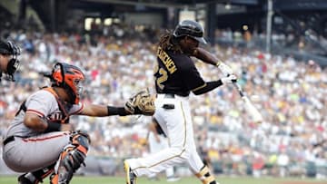 July 6, 2012; Pittsburgh, PA, USA; Pittsburgh Pirates center fielder Andrew McCutchen (22) hits an RBI single against the San Francisco Giants during the first inning at PNC Park. Mandatory Credit: Charles LeClaire-US PRESSWIRE
