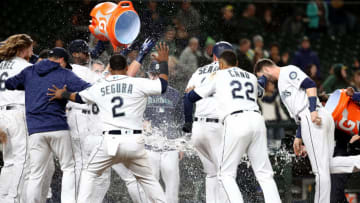 SEATTLE, WA - SEPTEMBER 25: The Seattle Mariners celebrate a two run home run by Chris Herrmann #26 of the Seattle Mariners against the Oakland Athletics in the eleventh inning to win the game 10-8 during their game at Safeco Field on September 25, 2018 in Seattle, Washington. (Photo by Abbie Parr/Getty Images)