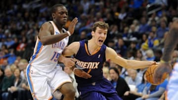 Nov 3, 2013; Oklahoma City, OK, USA; Phoenix Suns point guard Goran Dragic (1) handles the ball against Oklahoma City Thunder point guard Reggie Jackson (15) during the second quarter at Chesapeake Energy Arena. Mandatory Credit: Mark D. Smith-USA TODAY Sports