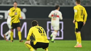 Dortmund's US midfielder Giovanni Reyna (C) and his teammates react after conceding the 1-4 goal during the German first division Bundesliga football match BVB Borussia Dortmund v VfB Stuttgart at the Signal Iduna Park Stadium in Dortmund, western Germany, on December 12, 2020. (Photo by Ina FASSBENDER / various sources / AFP) / DFL REGULATIONS PROHIBIT ANY USE OF PHOTOGRAPHS AS IMAGE SEQUENCES AND/OR QUASI-VIDEO (Photo by INA FASSBENDER/AFP via Getty Images)