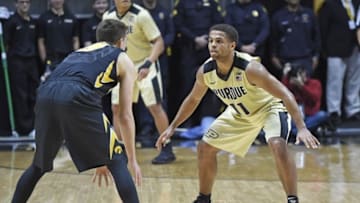 Dec 28, 2016; West Lafayette, IN, USA; Purdue Boilermakers guard P.J. Thompson (11) defends Iowa Hawkeyes guard Jordan Bohannon (3) in the first half at Mackey Arena. Mandatory Credit: Sandra Dukes-USA TODAY Sports