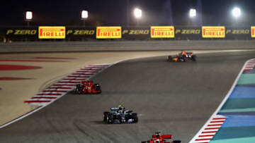 BAHRAIN, BAHRAIN - APRIL 08: Sebastian Vettel of Germany driving the (5) Scuderia Ferrari SF71H leads Valtteri Bottas driving the (77) Mercedes AMG Petronas F1 Team Mercedes WO9 on track during the Bahrain Formula One Grand Prix at Bahrain International Circuit on April 8, 2018 in Bahrain, Bahrain. (Photo by Clive Mason/Getty Images)
