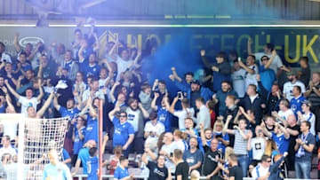 NORTHAMPTON, ENGLAND - SEPTEMBER 01: Tranmere Rovers fans let off a flare after James Norwood had scored their teams goal during the Sky Bet League Two match between Northampton Town and Tranmere Rovers at PTS Academy Stadium on September 1, 2018 in Northampton, United Kingdom. (Photo by Pete Norton/Getty Images)