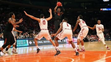 Mar 31, 2015; New York, NY, USA; Miami Hurricanes guard Sheldon McClellan (10) shoots over Temple Owls defense during the second half in the semifinals of the 2015 NIT college basketball tournament at Madison Square Garden. Miami Hurricanes won 60-57. Mandatory Credit: Anthony Gruppuso-USA TODAY Sports