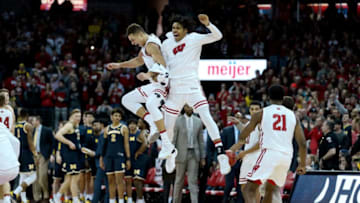MADISON, WISCONSIN - JANUARY 19: Kobe King #23 and Tai Strickland #13 of the Wisconsin Badgers celebrate after beating the Michigan Wolverines 64-54 at the Kohl Center on January 19, 2019 in Madison, Wisconsin. (Photo by Dylan Buell/Getty Images)