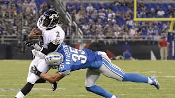 Aug 27, 2016; Baltimore, MD, USA; Baltimore Ravens quarterback Josh Johnson (2) runs as Detroit Lions strong safety Miles Killebrew (35) dives during the second half at M&T Bank Stadium. Mandatory Credit: Tommy Gilligan-USA TODAY Sports