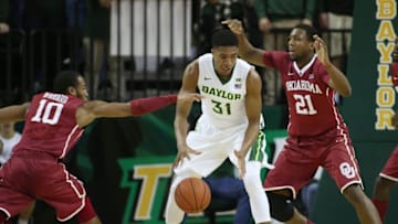 Jan 23, 2016; Waco, TX, USA; Oklahoma Sooners guard Jordan Woodard (10) steals the ball from Baylor Bears forward Terry Matson (31) at Ferrell Center. Oklahoma won 82-72. Mandatory Credit: Erich Schlegel-USA TODAY Sports