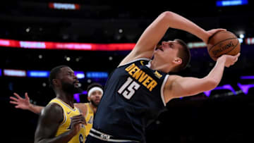 LOS ANGELES, CA - OCTOBER 02: Nikola Jokic #15 of the Denver Nuggets loses his balance as he is guarded by Lance Stephenson #6 of the Los Angeles Lakers during a preseason game at Staples Center on October 2, 2018 in Los Angeles, California. (Photo by Harry How/Getty Images)