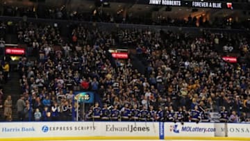 Oct 24, 2015; St. Louis, MO, USA; St. Louis Blues and fans honor former player Jimmy Robberts during the first period against the New York Islanders at Scottrade Center. Robberts passed away on October 23 2015 at the age of 75 from cancer. Mandatory Credit: Jeff Curry-USA TODAY Sports