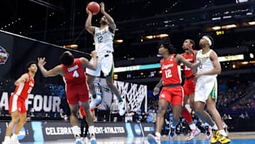INDIANAPOLIS, INDIANA - APRIL 03: Jared Butler #12 of the Baylor Bears drives to the basket against Justin Gorham #4 of the Houston Cougars in the first half during the 2021 NCAA Final Four semifinal at Lucas Oil Stadium on April 03, 2021 in Indianapolis, Indiana. (Photo by Jamie Squire/Getty Images)
