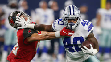 Aug 29, 2019; Arlington, TX, USA; Dallas Cowboys running back Mike Weber (40) stiff arms Tampa Bay Buccaneers linebacker Jack Cichy (48) in the second quarter at AT&T Stadium. Mandatory Credit: Tim Heitman-USA TODAY Sports