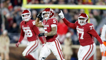 Oklahoma's Billy Bowman (5) celebrates an interception with Danny Stutsman (28) and Jeffery Johnson (77) in the first half during the Bedlam college football game between the University of Oklahoma Sooners (OU) and the Oklahoma State University Cowboys (OSU) at Gaylord Family-Oklahoma Memorial Stadium, in Norman, Okla., Saturday, Nov., 19, 2022.oufoot1