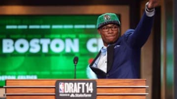 Jun 26, 2014; Brooklyn, NY, USA; Marcus Smart (Oklahoma State) waves to the crowd as he leaves the stage after being selected as the number six overall pick to the Boston Celtics in the 2014 NBA Draft at the Barclays Center. Mandatory Credit: Brad Penner-USA TODAY Sports