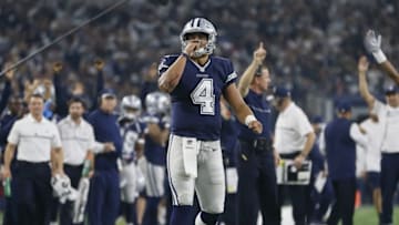 Nov 24, 2016; Arlington, TX, USA; Dallas Cowboys quarterback Dak Prescott (4) celebrates throwing a touchdown in the second quarter against the Washington Redskins at AT&T Stadium. Mandatory Credit: Tim Heitman-USA TODAY Sports