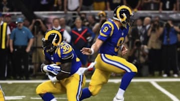 Oct 13, 2014; St. Louis, MO, USA; St. Louis Rams quarterback Austin Davis (9) hands the ball off to St. Louis Rams running back Zac Stacy (30) against the San Francisco 49ers during the first half at the Edward Jones Dome. Mandatory Credit: Jasen Vinlove-USA TODAY Sports