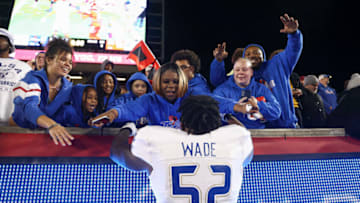Auburn footballNov 26, 2022; Houston, Texas, USA; Tulsa Golden Hurricane offensive lineman Dillon Wade (52) celebrates with fans after the game against the Houston Cougars at TDECU Stadium. Mandatory Credit: Troy Taormina-USA TODAY Sports