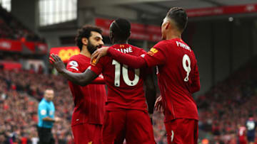 LIVERPOOL, ENGLAND - MARCH 07: Sadio Mane of Liverpool celebrates with Mohamed Salah and Roberto Firmino after scoring his team's second goal during the Premier League match between Liverpool FC and AFC Bournemouth at Anfield on March 07, 2020 in Liverpool, United Kingdom. (Photo by Jan Kruger/Getty Images)