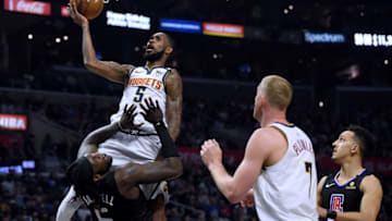LOS ANGELES, CALIFORNIA - FEBRUARY 28: Will Barton #5 of the Denver Nuggets reacts as he is called for a charging foul on Montrezl Harrell #5 of the LA Clippers as Mason Plumlee #7 and Landry Shamet #20 look on during the fourth quarter in a 132-103 Clippers win at Staples Center on February 28, 2020 in Los Angeles, California. (Photo by Harry How/Getty Images)