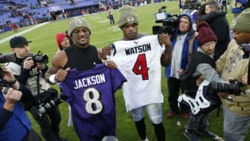 BALTIMORE, MARYLAND - NOVEMBER 17: Quarterback Lamar Jackson #8 of the Baltimore Ravens exchange jerseys with quarterback Deshaun Watson #4 of the Houston Texans after the Baltimore Ravens 41-7 win over the Houston Texans at M&T Bank Stadium on November 17, 2019 in Baltimore, Maryland. (Photo by Todd Olszewski/Getty Images)