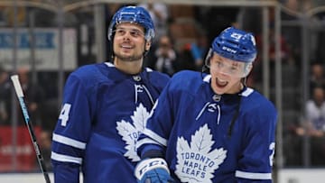 TORONTO, ON - FEBRUARY 23: Travis Dermott #23 and Auston Matthews #34 of the Toronto Maple Leafs seem very pleased with victory against the Montreal Canadiens in an NHL game at Scotiabank Arena on February 23, 2019 in Toronto, Ontario, Canada. The Maple Leafs defeated the Canadiens 6-3. (Photo by Claus Andersen/Getty Images)