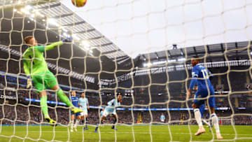 MANCHESTER, ENGLAND - DECEMBER 15: Raheem Sterling of Manchester City scores his team's third goal past Jordan Pickford of Everton during the Premier League match between Manchester City and Everton FC at Etihad Stadium on December 15, 2018 in Manchester, United Kingdom. (Photo by Clive Brunskill/Getty Images)