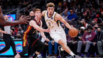 Feb 8, 2022; Atlanta, Georgia, USA; Indiana Pacers guard Chris Duarte (3) dribbles past Atlanta Hawks guard Kevin Huerter (3) during the first half at State Farm Arena. Mandatory Credit: Dale Zanine-USA TODAY Sports