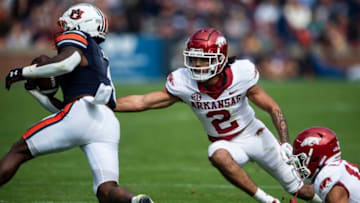 Auburn Tigers running back Tank Bigsby (4) jukes Arkansas Razorbacks defensive back Myles Slusher (2) as the Auburn Tigers take on Arkansas Razorbacks at Jordan-Hare Stadium in Auburn, Ala., on Saturday, Oct. 29, 2022. Arkansas Razorbacks defeated Auburn Tigers 41-27.